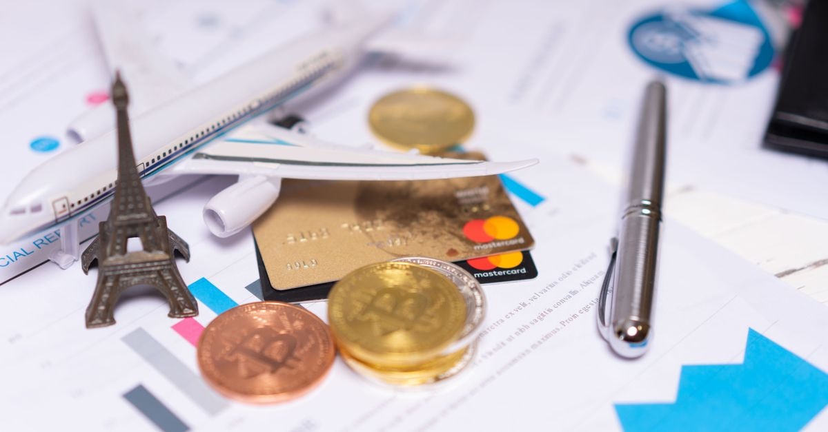 Axis Bank and Visa launch 'Dil Se Open Celebrations 2026' festive credit card campaign with Shahid Kapoor A travel finance concept featuring cryptocurrency, credit card, airplane model, and Eiffel Tower on financial documents.
