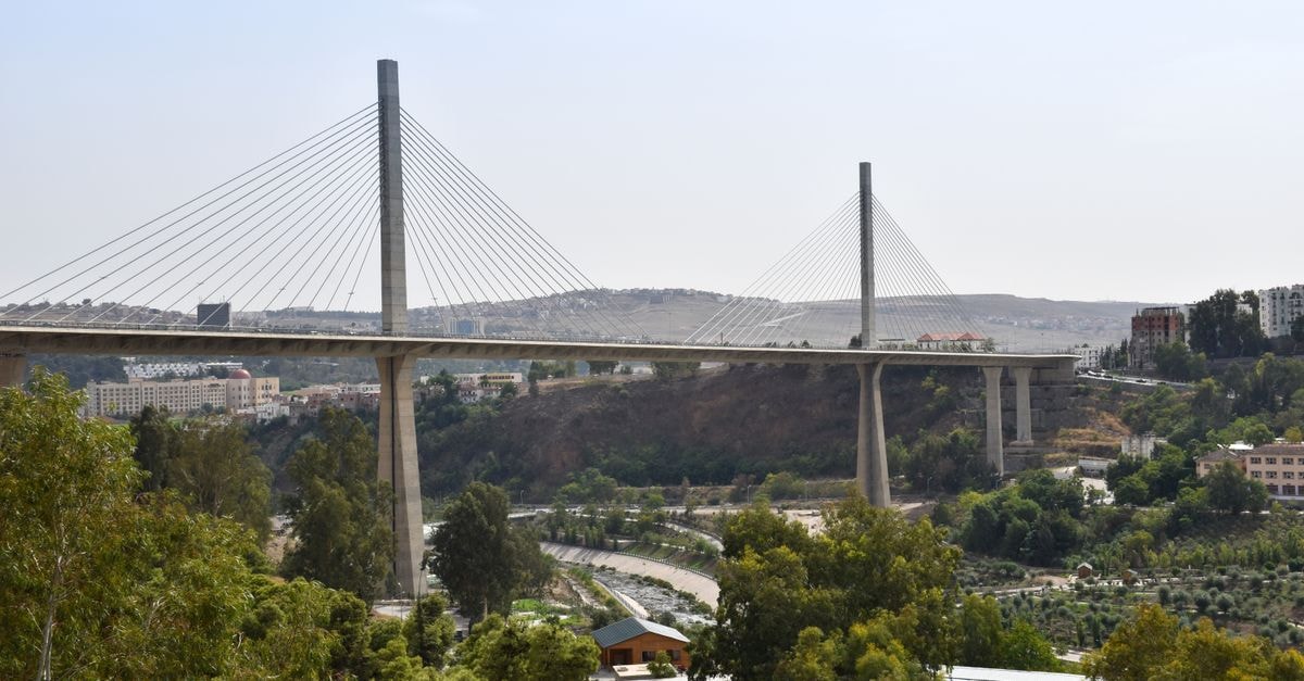 El Kef Travel Guide: Planning Tips, Costs and Things to Do Aerial view of the Salah Bey Viaduct, a stunning suspension bridge in Algiers, Algeria.