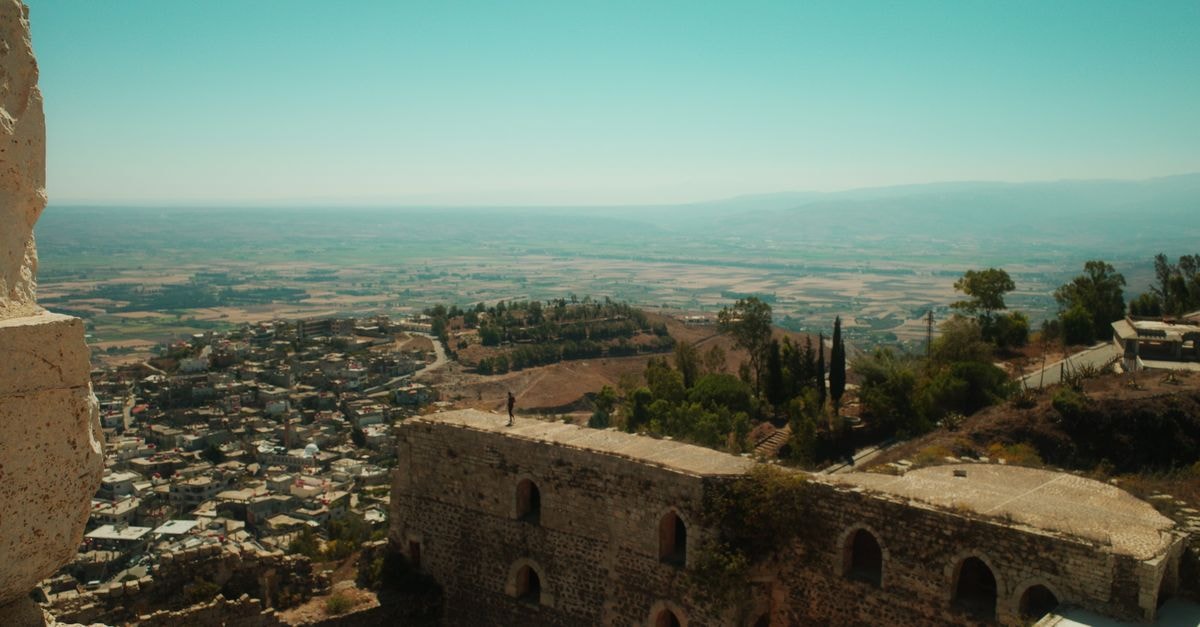 New Basman Hotel in Homs: A Classic Stay on Damascus Road Stunning panoramic view from al-Husn Castle overlooking the town and landscape in Homs, Syria.