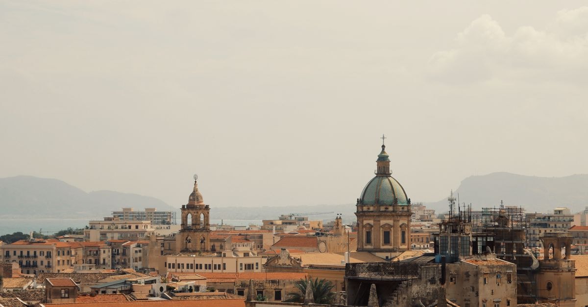 Aerial view of majestic domes amidst the vibrant cityscape of Palermo, Sicily, Italy.