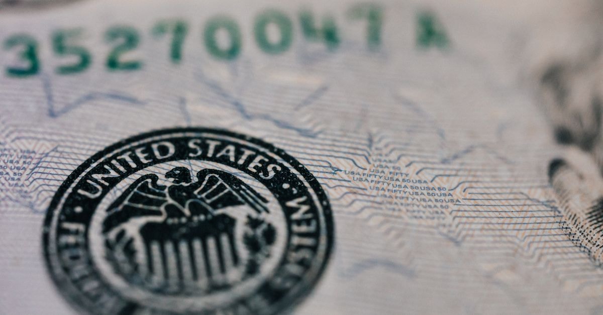 Oil Prices Close July With Biggest Monthly Gain Since March as US-Iran War Reshapes Crude Flows From above closeup of national symbol of USA paper money representing official seal with eagle with olive oil and arrow sitting on shield