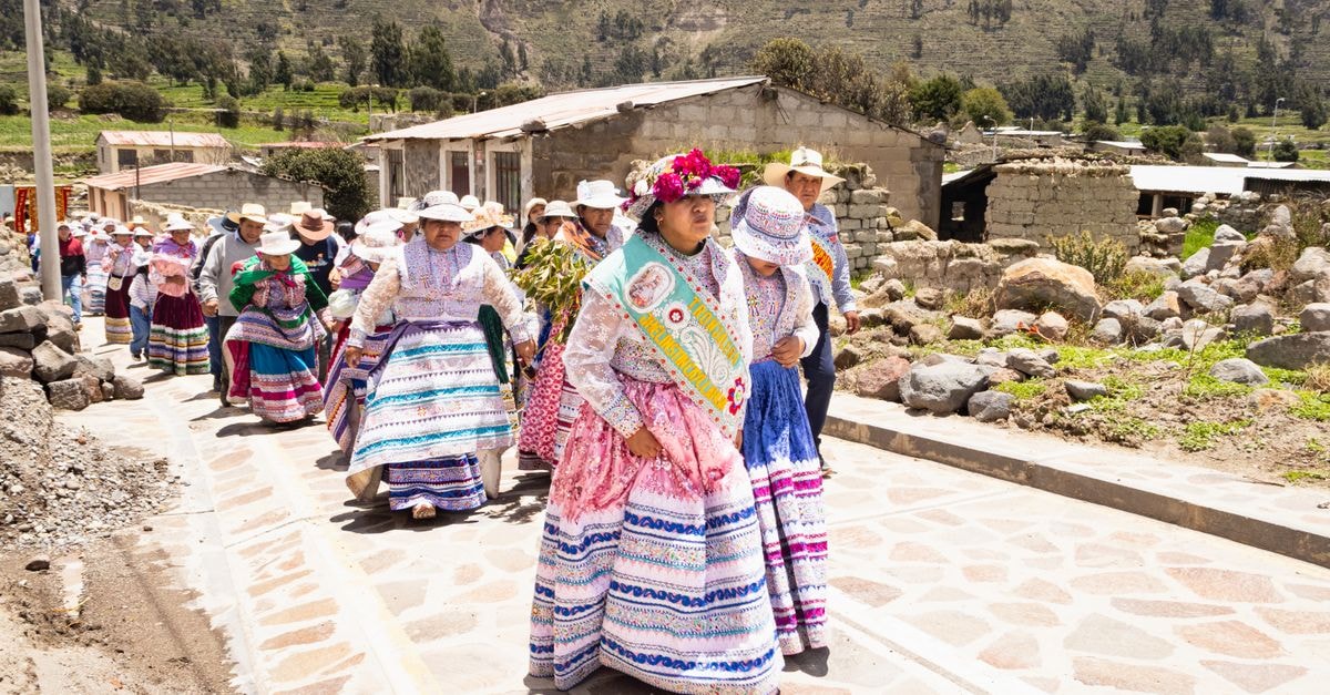 Vibrant traditional dance parade in Caylloma, showcasing rich Andean cultural heritage.