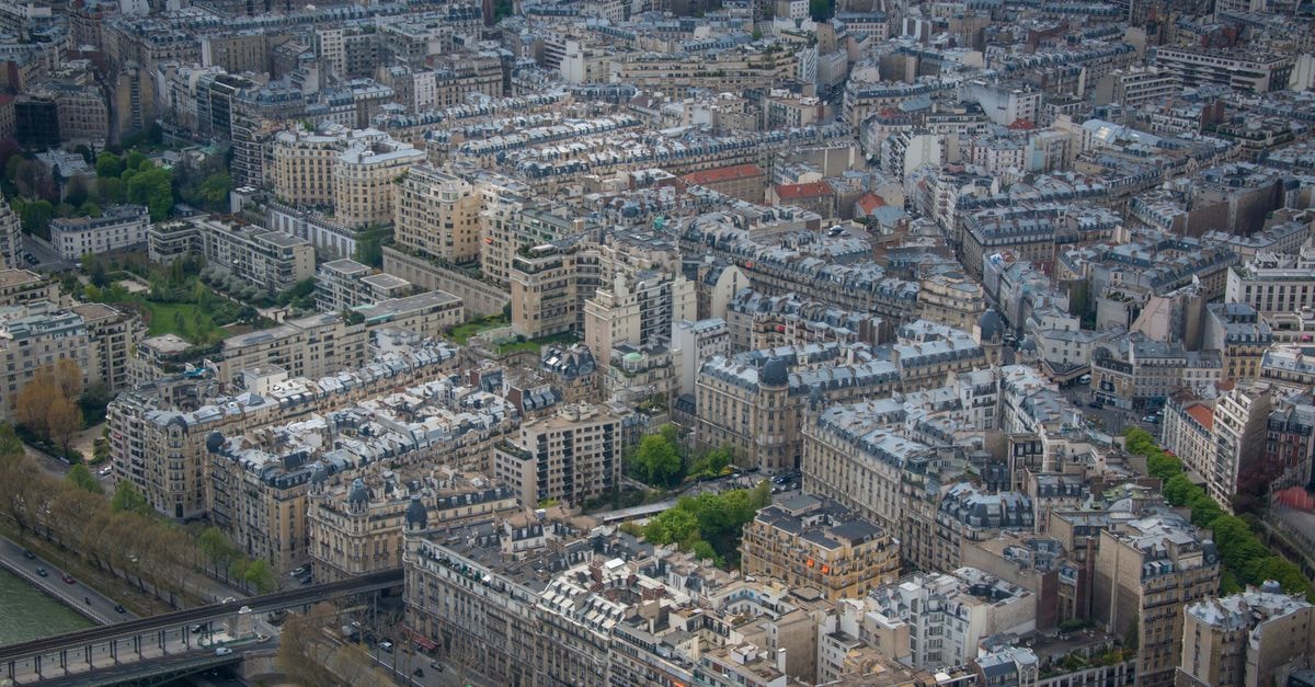 Aerial view capturing the dense architectural landscape of Paris cityscape.