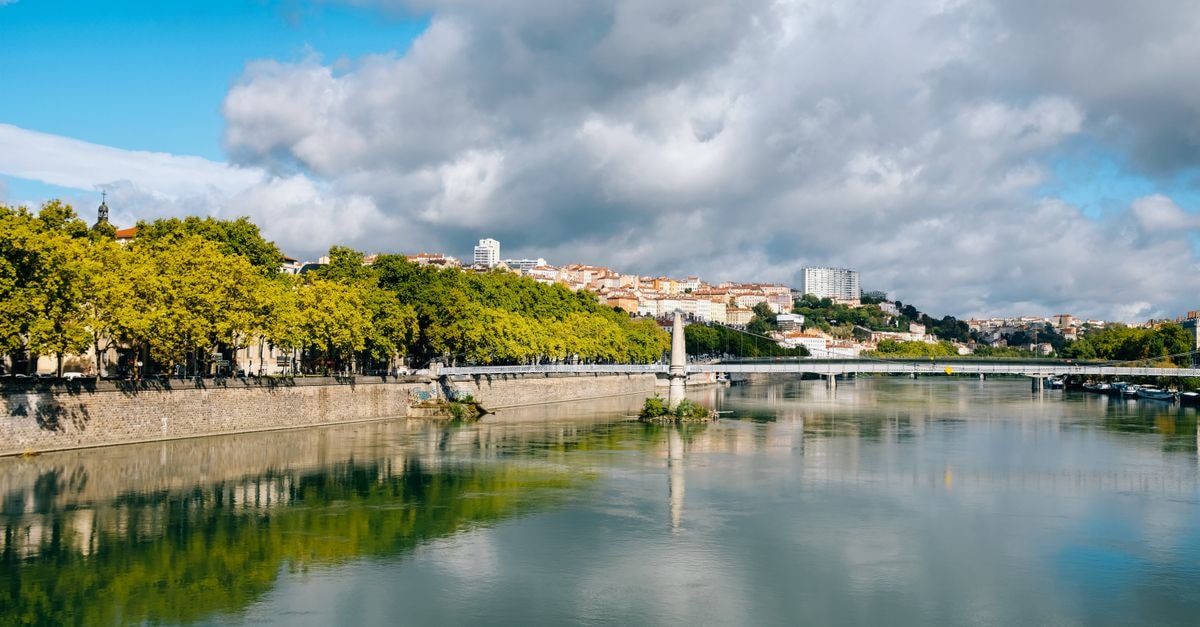 Ségou Travel Guide: A Slow-Paced Riverside City Worth the Detour Picturesque view of small contemporary town located on peaceful river coast near abundant green trees on sunny summer weather
