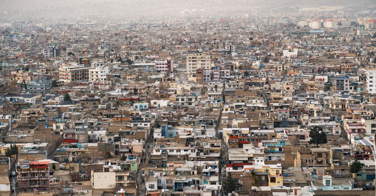 Safi Landmark, Kabul: Downtown Hub Since 2005 Expansive aerial view of Kabul city, showcasing urban density and surrounding mountains in Afghanistan.