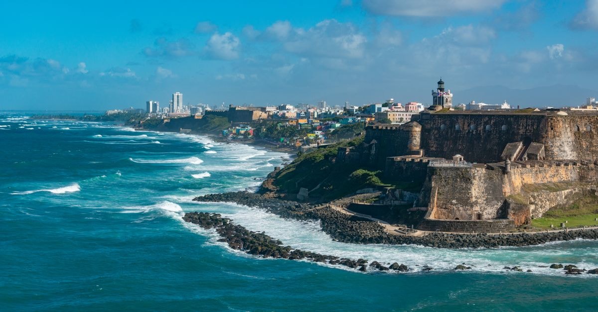 Explore the historic Castillo San Felipe del Morro overlooking the vibrant coastline of San Juan, Puerto Rico.