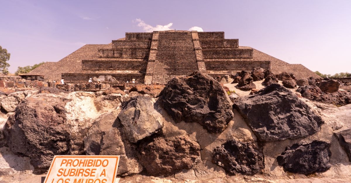 Cholula Travel Guide: Pyramids, Churches, and Local Flavor View of Pyramid of the Moon in Teotihuacan, Mexico, with a prohibition sign.
