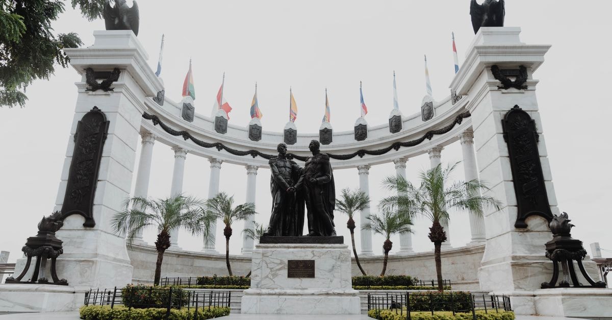 Gonaïves travel guide: exploring Haiti's independence city Captivating view of Hemiciclo de la Rotonda monument with statues and flags in Guayaquil.