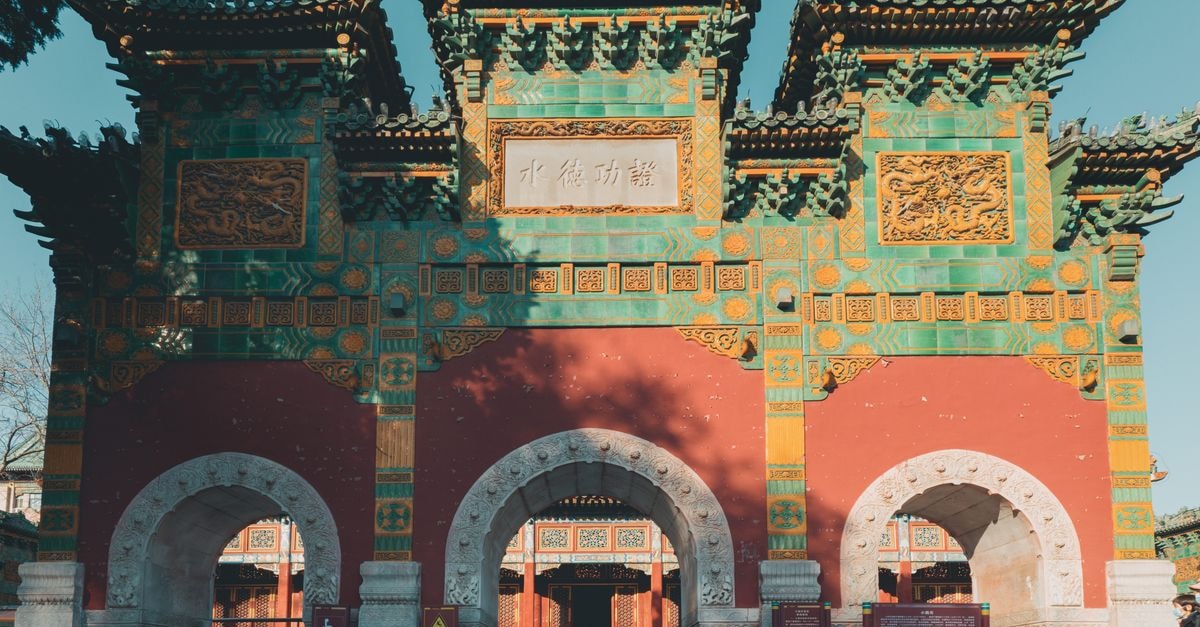 Beihai Travel Guide: A Slow Week on China's Beibu Gulf Coast Vibrant gateway in Beihai Park, Beijing under clear blue skies.