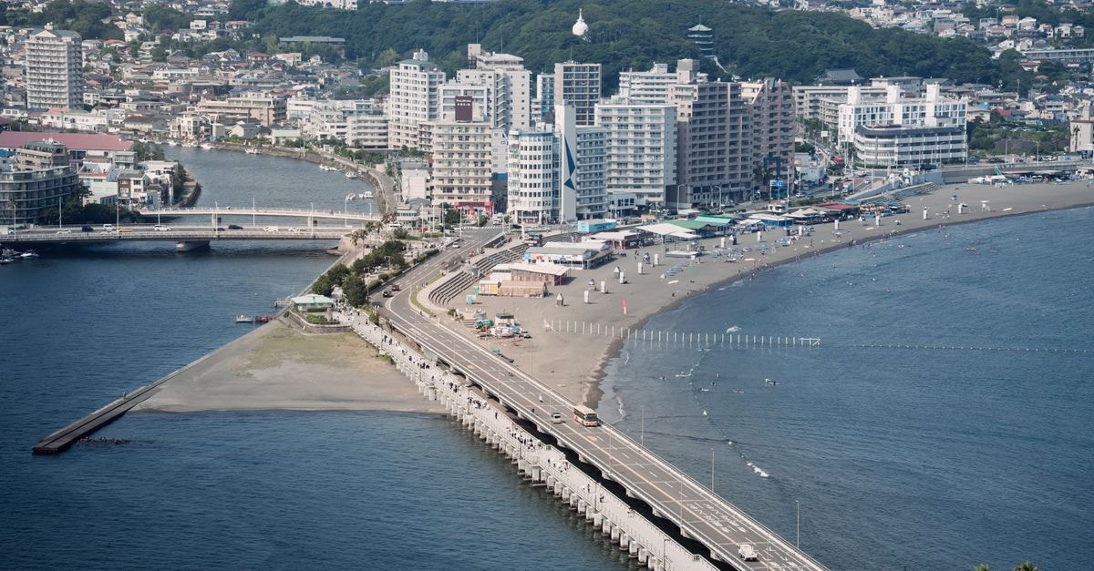 Dormy Inn Takamatsuchuokoenmae in Takamatsu: A Natural Hot Spring Hotel Near Tenjinmae Stunning aerial view of Enoshima bridge, beach, and cityscape along the Tokyo coastline.