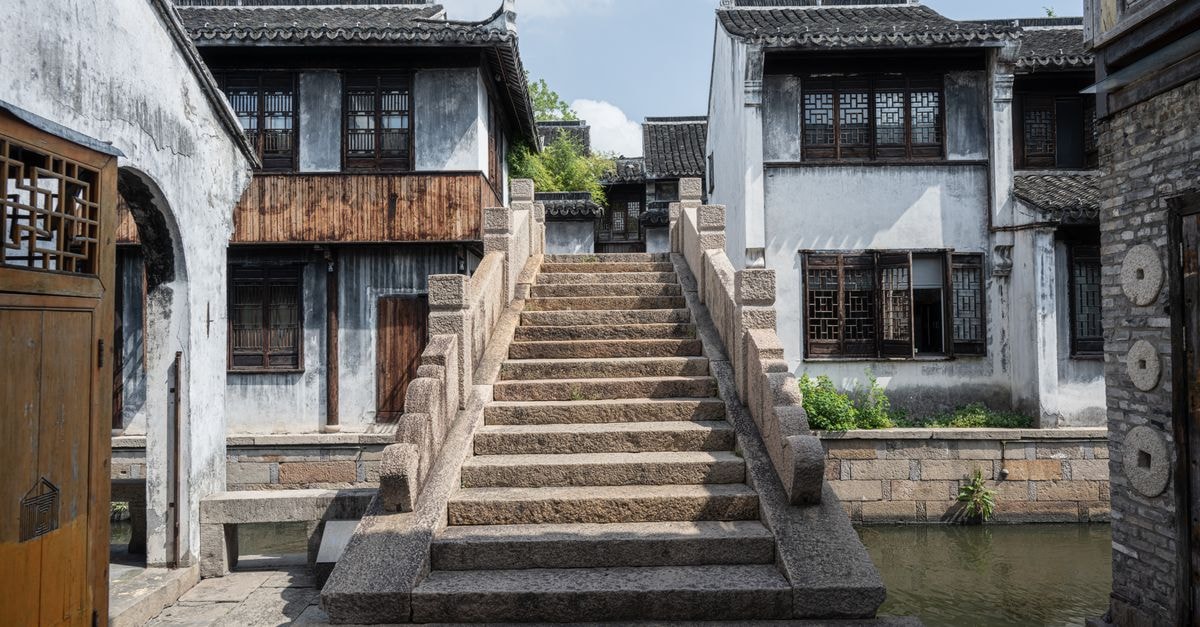 Guli Travel Guide: Slow Days in a Zhejiang Riverside Town Stone bridge and traditional buildings in a historic Chinese water town.