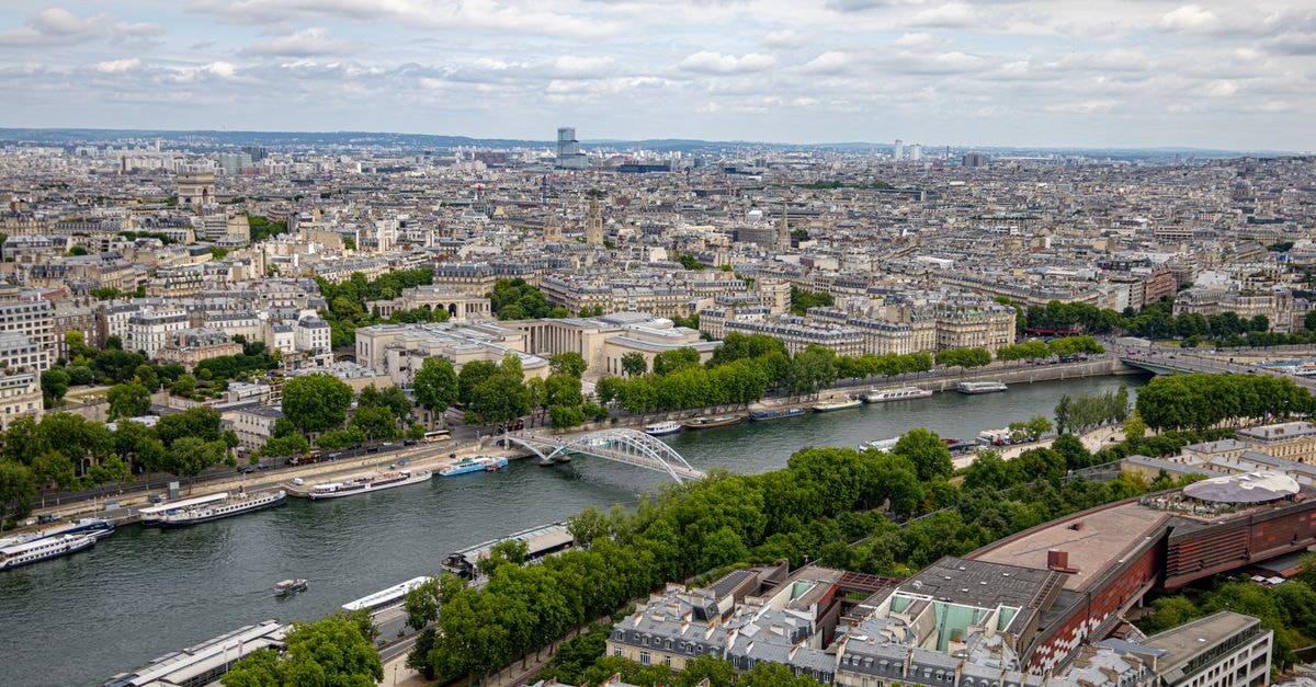Aerial view of Paris cityscape with the Seine River and beautiful architecture.