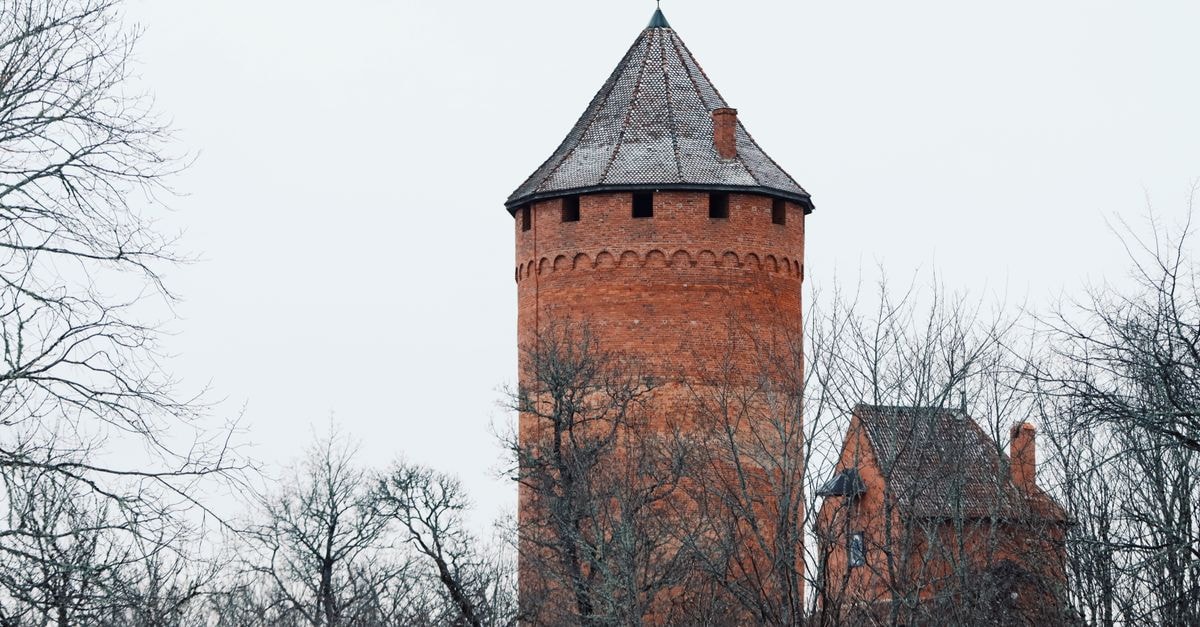 Jelgava travel guide: a quiet Latvian city worth slowing down for Explore the historic Turaida Castle Tower amidst the serene winter landscape of Latvia.