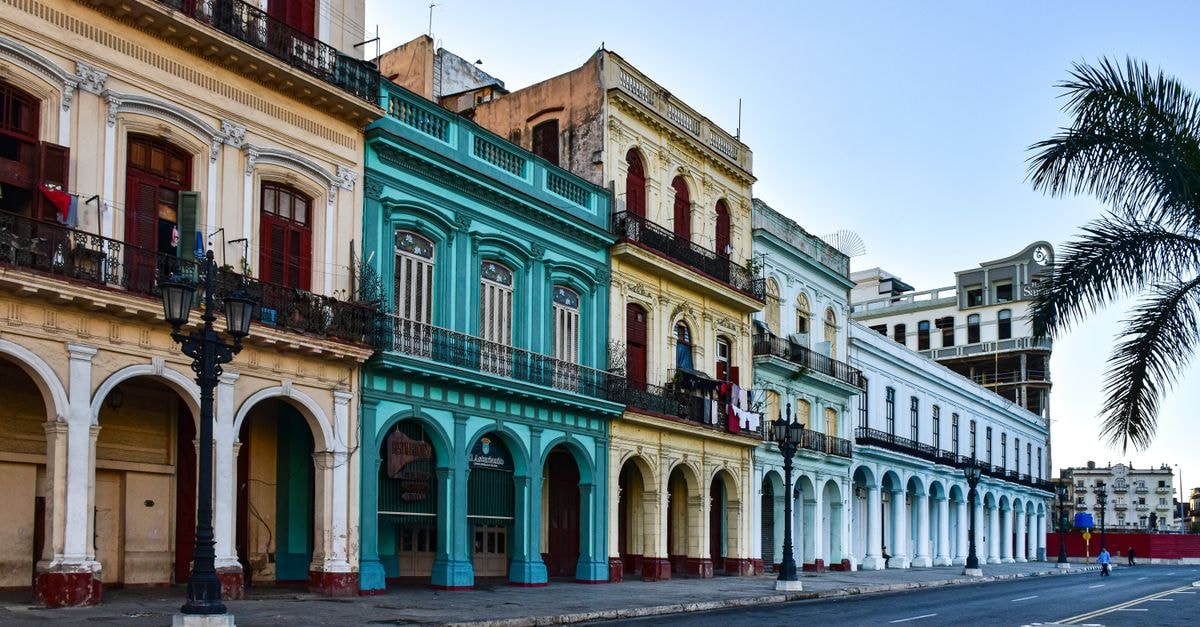 Vibrant colonial facades line the streets of Havana, Cuba, showcasing historic architecture.