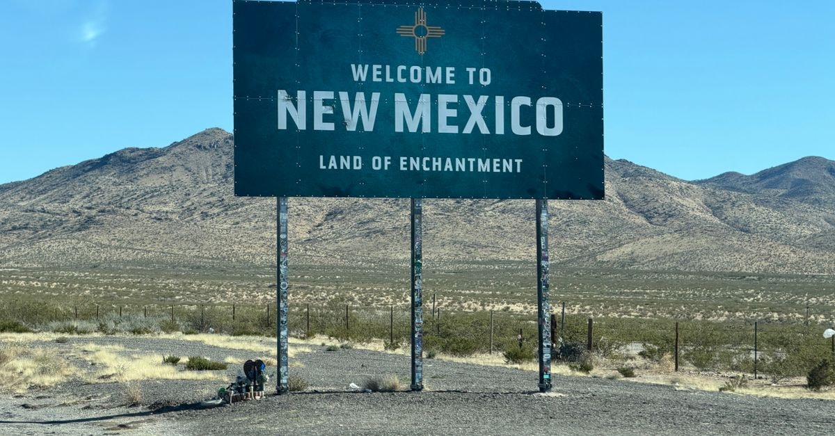 Iconic welcome sign for New Mexico in a desert landscape, tracing the state's enchanting charm.