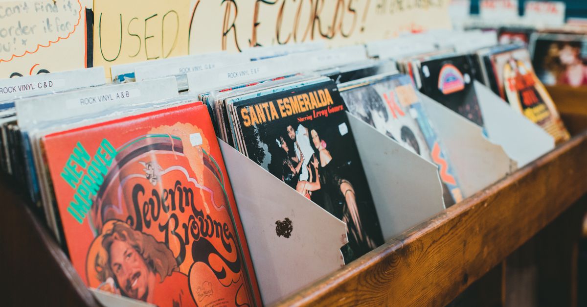 K-pop comebacks: Jennie drops 'Less than a Lover' solo single as Taemin unveils new album and world tour Close-up of vintage vinyl records in a music store display, emphasizing classic album covers.