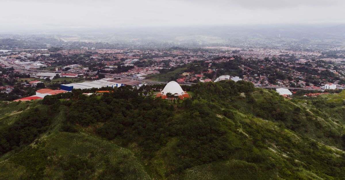 Antipolo City Travel Guide: Planning Tips, Costs and Things to Do A stunning aerial view of Panama City with lush green hills and urban landscape.