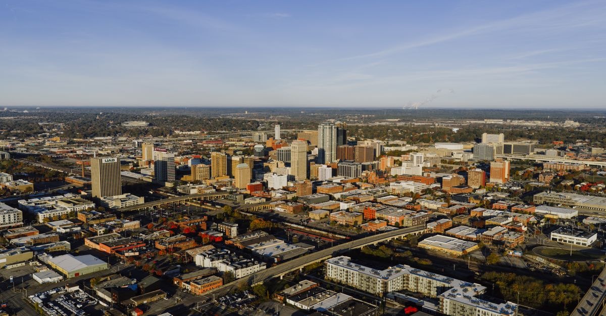 Home2 Suites by Hilton in Montgomery: Tech-Savvy Suites Downtown Aerial photograph showcasing Birmingham, Alabama's urban skyline and city layout.