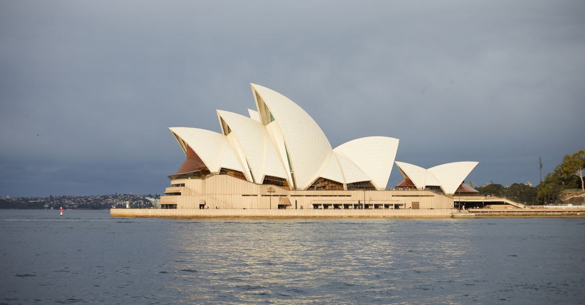 Australian Chamber Choir begins eighth European tour; Darwin venues warn Top End tours are unprofitable Iconic Sydney Opera House with overcast sky, a top travel destination in Australia.