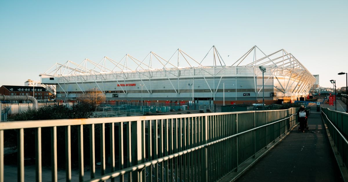 Travelodge Southampton: A Handy Base Near SeaCity Museum View of St Mary's Stadium in Southampton during sunset with a clear sky.