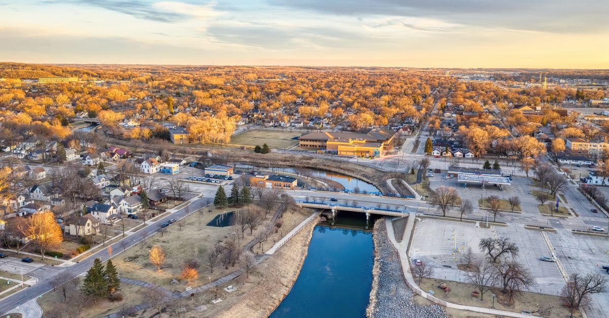 Scenic aerial view of Rochester, Minnesota highlighting the cityscape and river at sunset.