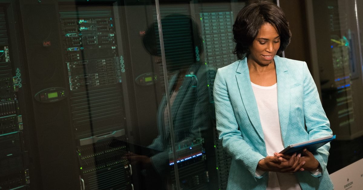 Via Transportation: Profitable Growth Story or Pre-Profit Speculation? Female IT professional examining data servers in a modern data center setting.