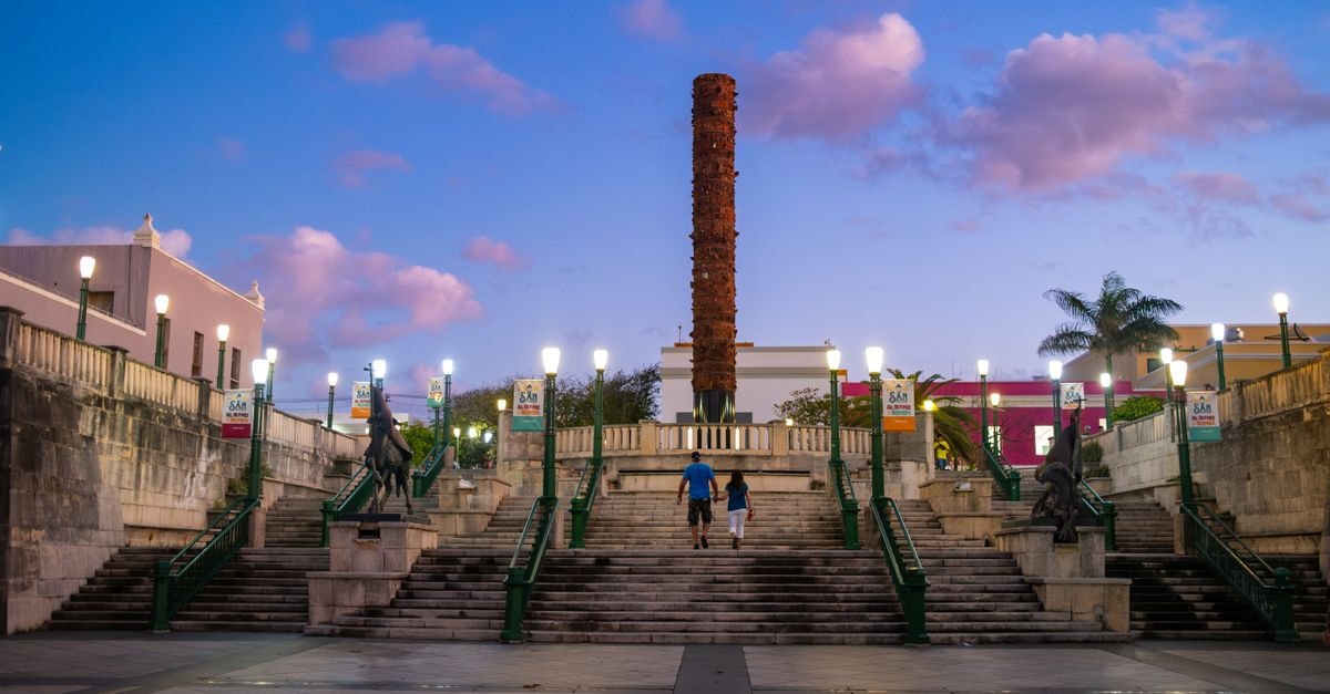 Scenic evening view of Totem Square with vibrant sky in Old San Juan, Puerto Rico.
