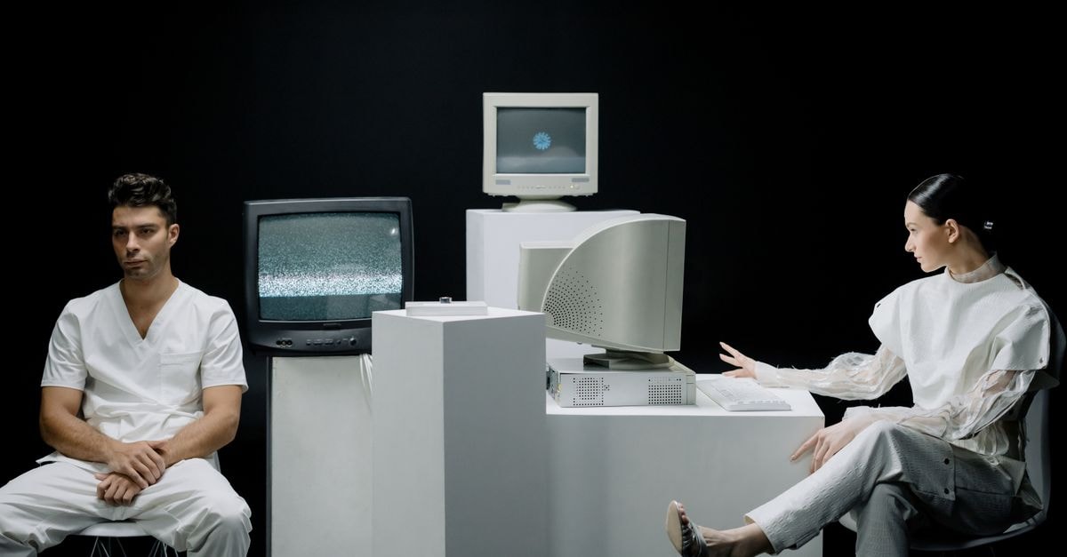 Fabrinet Drops on Soft Guidance, Dragging Amphenol and Marvell Lower A modern depiction with vintage computers and individuals in a futuristic lab setting.