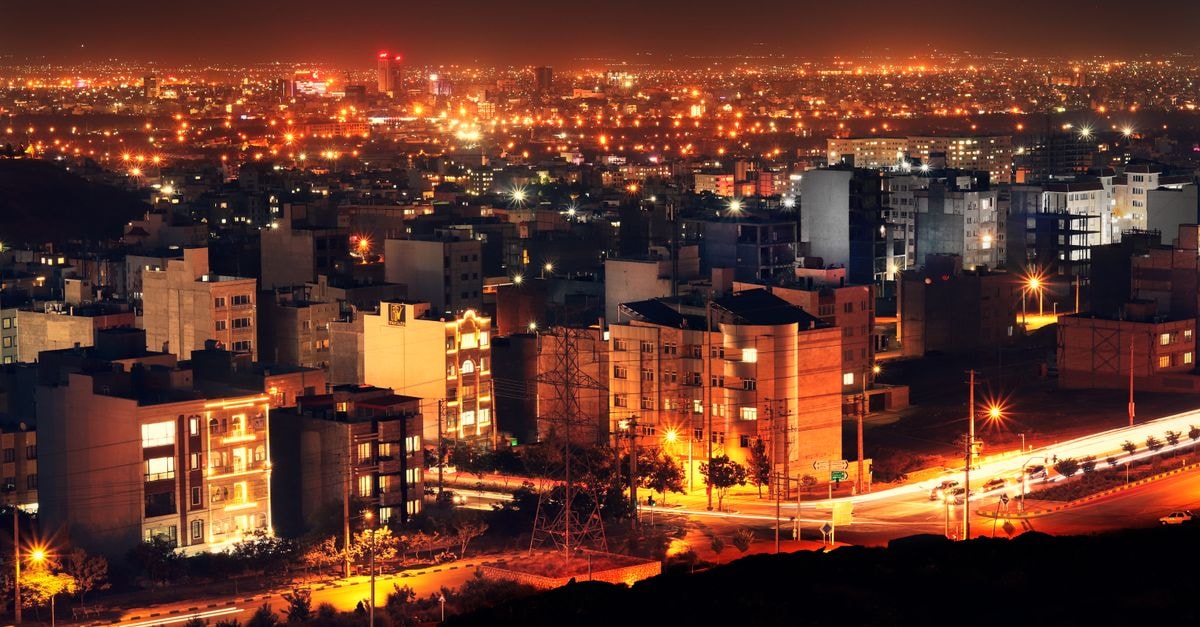 Sahand Hotel in Tabriz: A City-Center Stay Near the Bazaar A breathtaking aerial view of Mashhad city lights at night, showcasing the urban landscape of Iran.