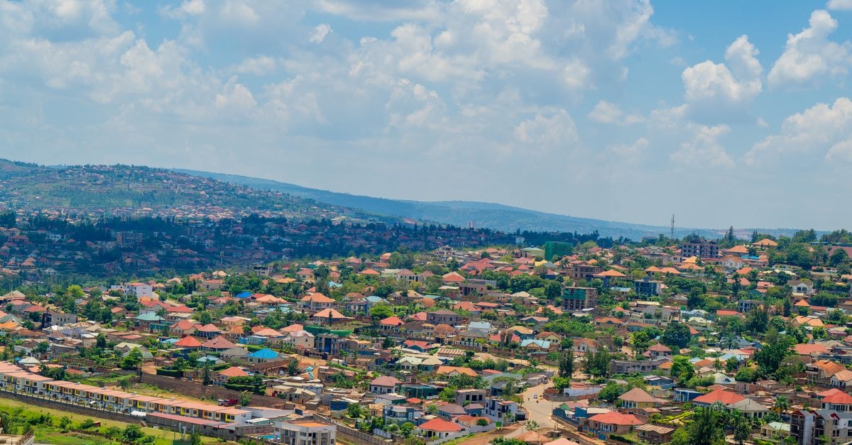 Okaoni Hotel in Dodoma: A Quiet Stop on Sokoine Road Aerial view of Kigali cityscape with colorful rooftops and vibrant greenery under a bright sky.