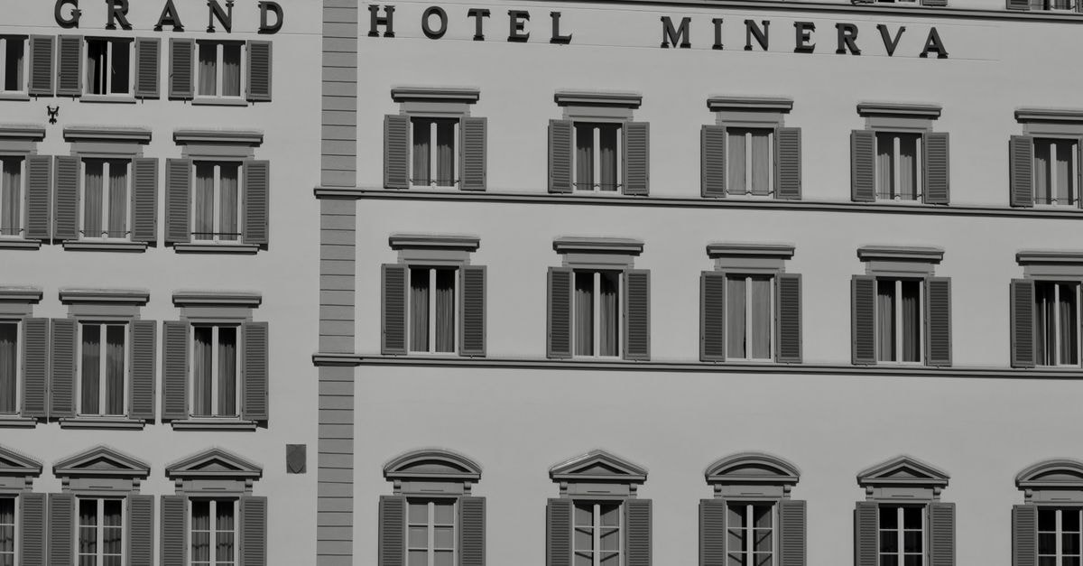 Grand Hotel Ambositra, Madagascar — A 1912 Pioneer of Local Tourism Black and white photo of Grand Hotel Minerva's elegant facade in Florence, Italy.