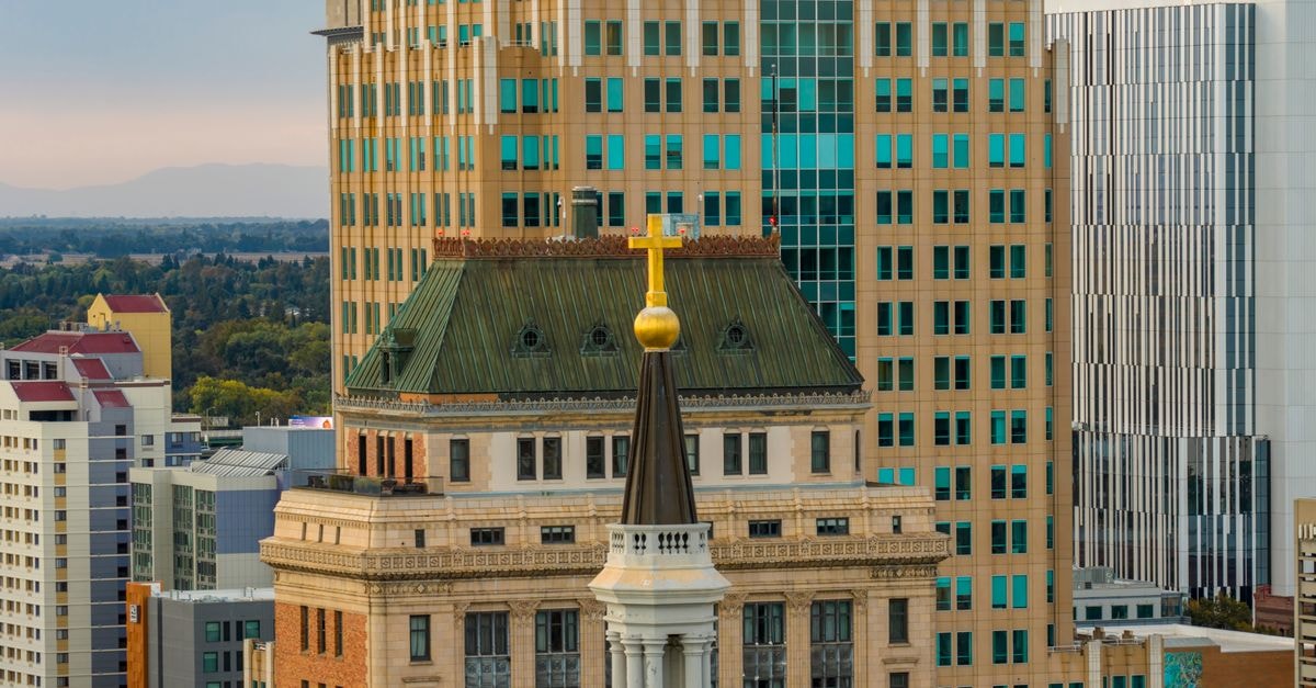 The Classic Villa, Christchurch — A Heritage-Awarded Boutique on Worcester Boulevard A breathtaking view of historic and modern buildings in downtown Sacramento, California during the day.
