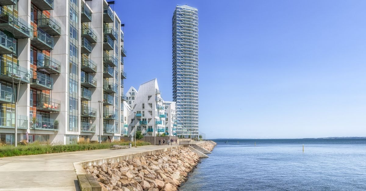 Aarhus Travel Guide: Planning Tips, Costs and Things to Do Contemporary architecture along the Aarhus waterfront, showcasing urban living and innovative design.