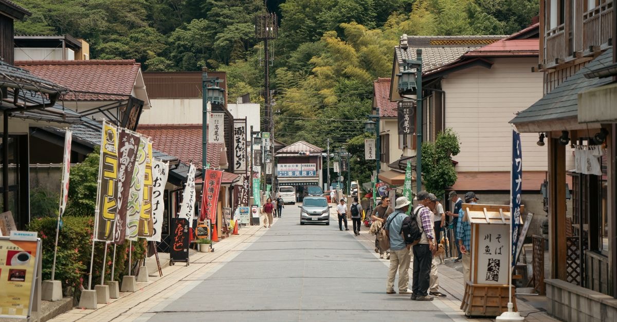 Gifu City Travel Guide: Quiet Capital, Easy Access Explore a quiet street in Hachiōji with traditional shops and lush surroundings.