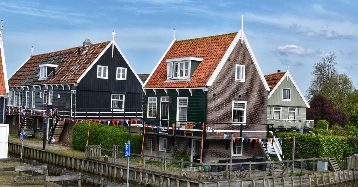 Groningen, Netherlands Travel Guide: Northern Dutch Charm Picturesque village houses by the canal with traditional Dutch architecture.