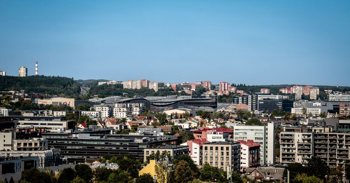 Hotel Katrina Cēsis: Old-Town Stay by Cēsis Castle Panoramic view of Vilnius skyline featuring modern and historic architecture under a clear blue sky.