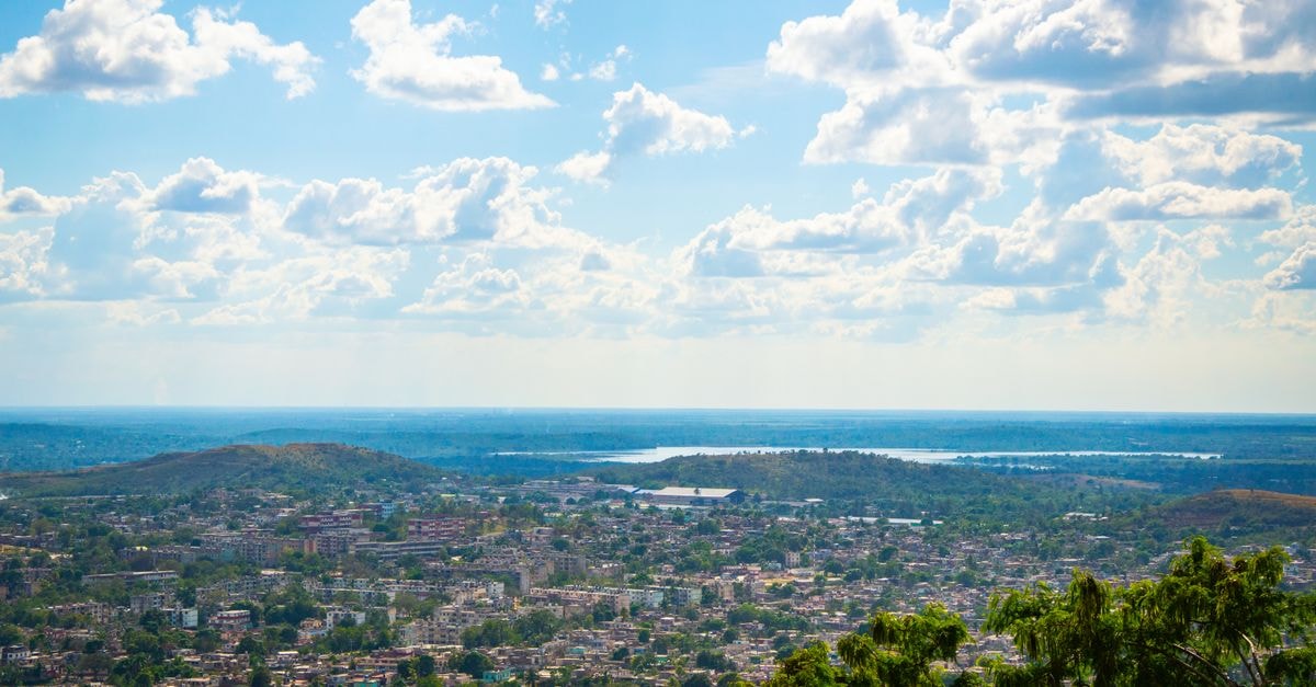 Imperial Town Hotel in Lilongwe: A Bed-and-Breakfast in Old Town Aerial view of city under a bright blue sky with scattered clouds.