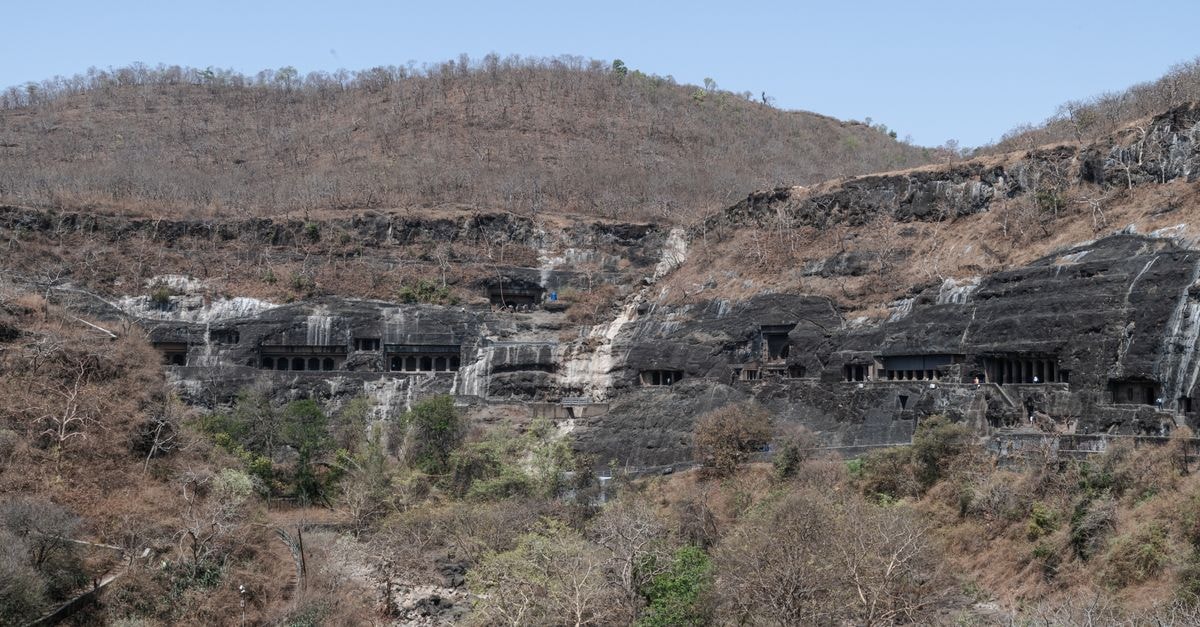 Ambarnath Travel Guide: Climate Context and Indian Food Explore the historic Ajanta Caves carved into a hillside in Maharashtra, India.
