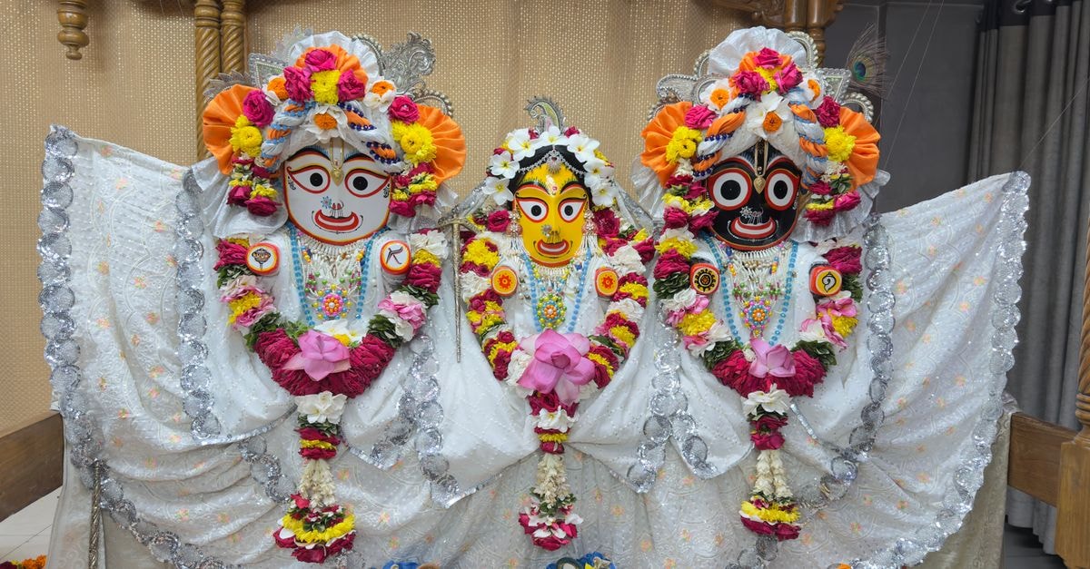 Jagannath in Nagpur: Practical Ajni Road Stay Near Dhantoli Vibrant Jagannath, Balabhadra, and Subhadra idols adorned with flowers and ornaments indoors.