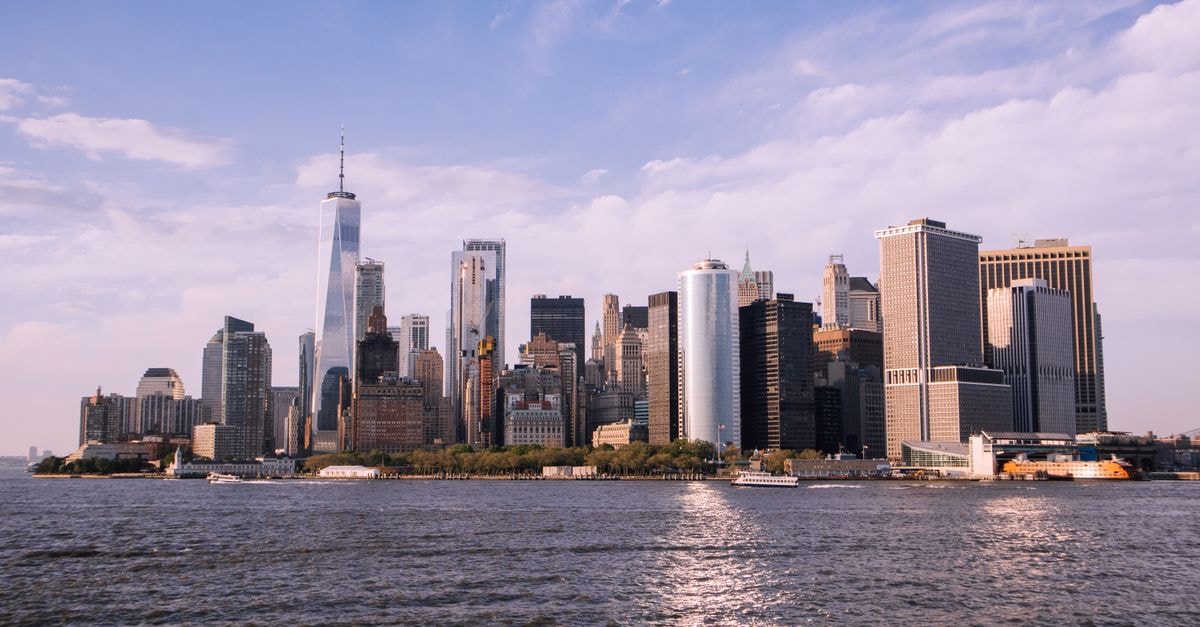 Scenic view of Manhattan skyline and Hudson River with clear sky.