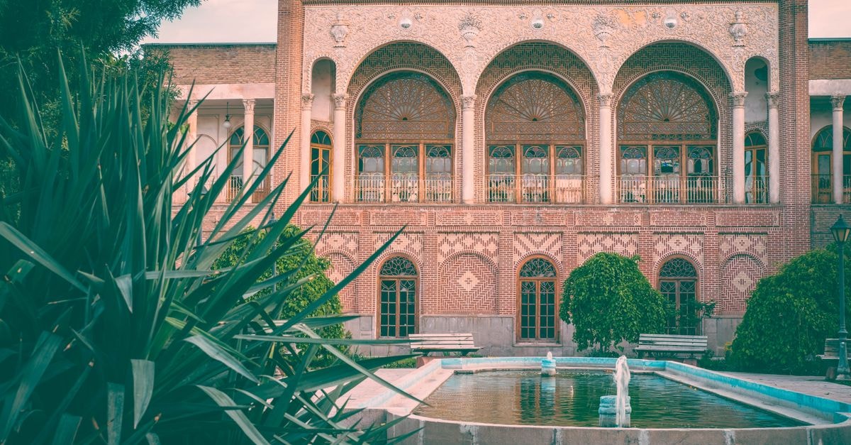 Slow Days in Kerman: A Quiet Travel Guide to Iran's Historic Southeast Stunning view of Behnam House, a landmark in Tabriz, Iran, with beautiful gardens and fountain.