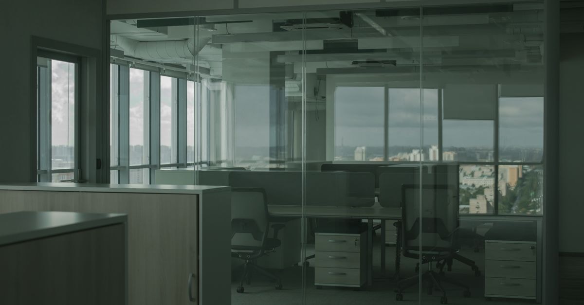 Pfizer Advances ELREXFIO Filing Plan as Investors Await Q3 Results Spacious empty office with glass walls and city views, ideal for modern workspace settings.