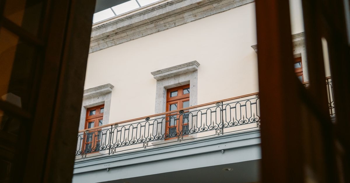 Tlalnepantla Travel Guide: A Quieter Doorway Into Central México Elegant architectural view of a balcony in Ciudad de México with warm tones.