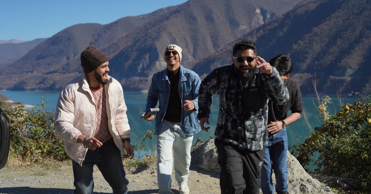 Shah Rukh Khan's 'King' to hold December 24 release against 'Avengers: Doomsday' A group of friends having fun while exploring the scenic mountains of Georgia on a sunny day.