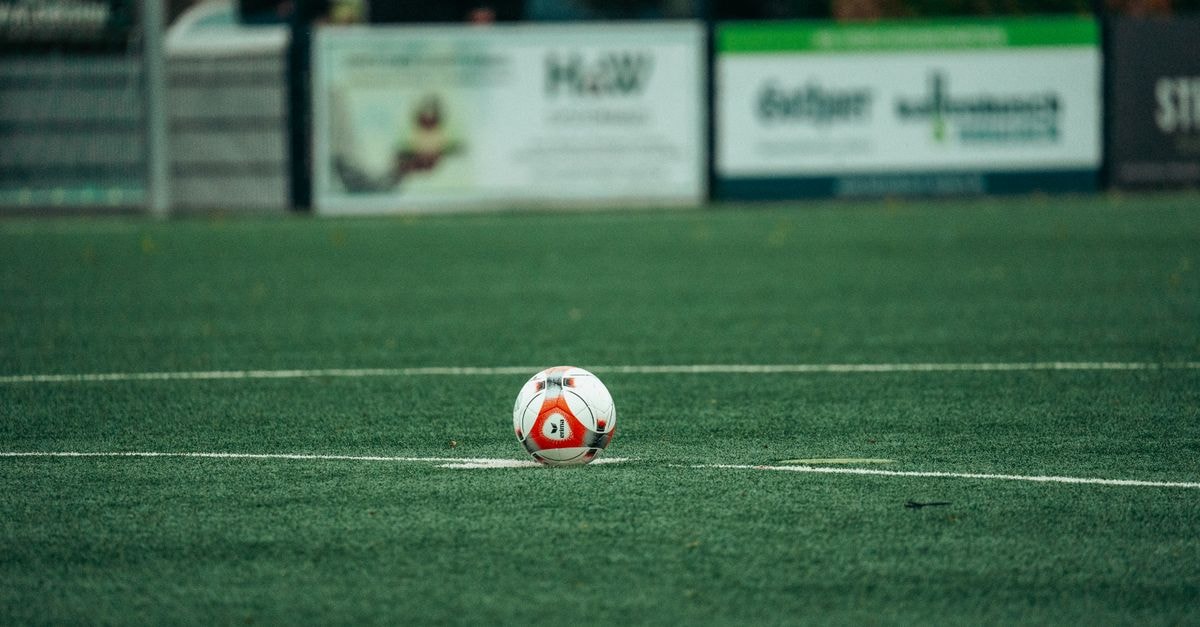 Galdiano leads Portland Classic by one shot after opening round A detailed shot of a soccer ball on a lush green field, perfect for sports-related themes.