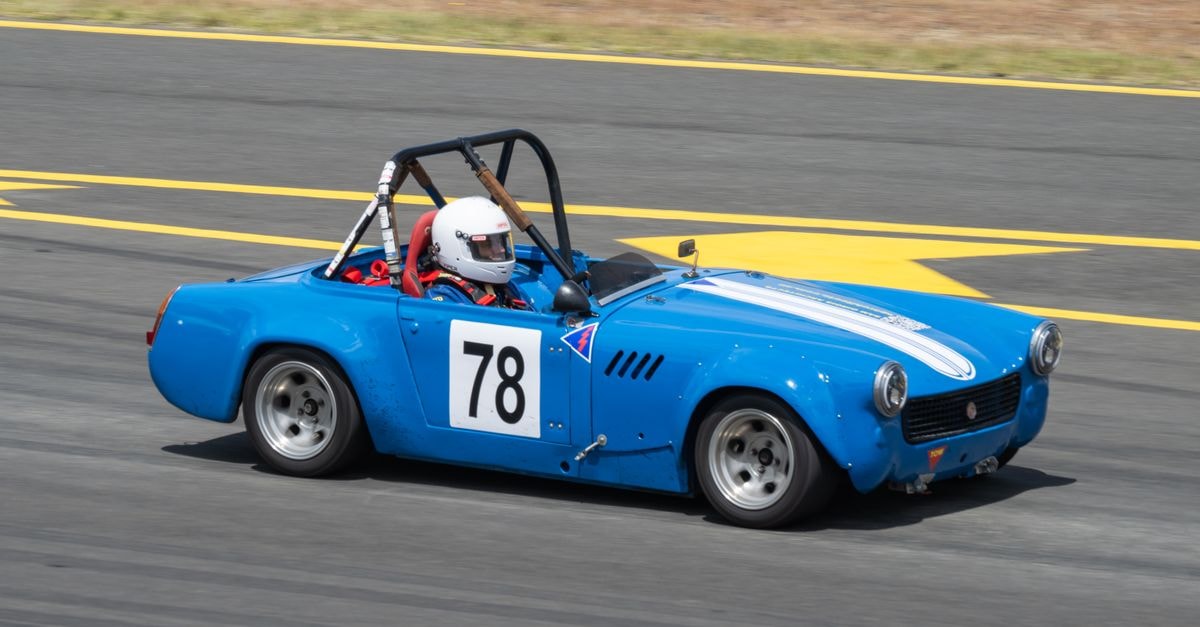 Villa 78, Tunis — A Precise Address on Mohammad V Avenue Classic blue racing car number 78 speeding on the track during a sunny day.