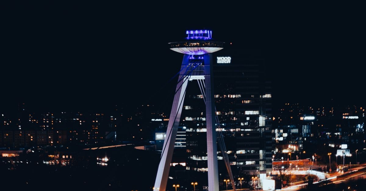 Reverie Hotel in Bratislava: Calm Old-Town Stay on Vysoká Stunning night view of the UFO Observation Deck in Bratislava, Slovakia, showcasing the city's vibrant skyline.