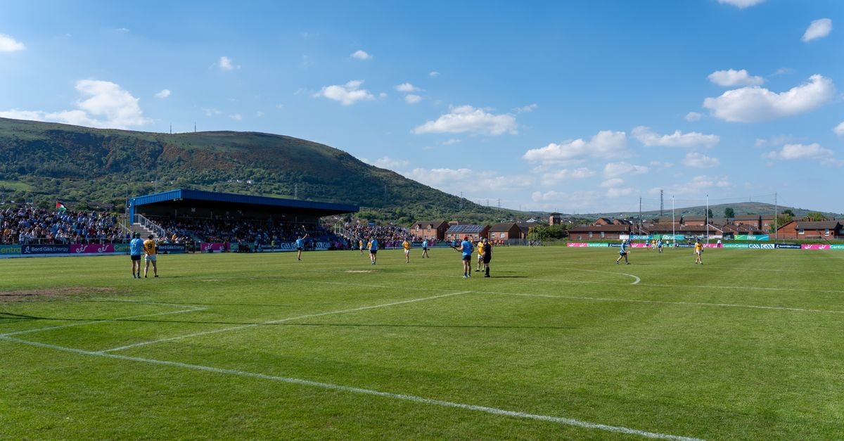 Ireland beats Israel 3-0 as protest gestures overshadow Nations League match A lively Gaelic football match under blue skies with scenic hills in Ireland.