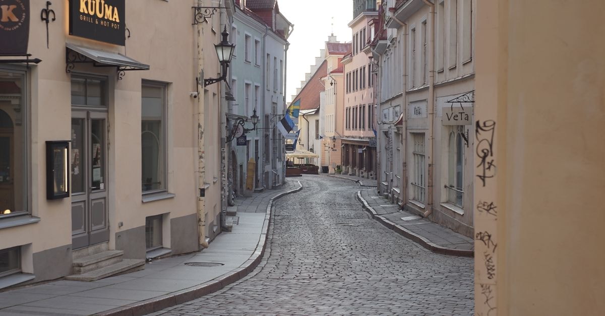Quiet cobblestone street in Tallinn's Old Town, featuring historic architecture and a peaceful atmosphere.