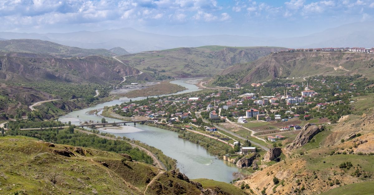 Ahvāz Travel Guide: Planning Tips, Costs and Things to Do Aerial view of Palu, Elazığ, Türkiye, featuring the winding Euphrates River and surrounding hills.